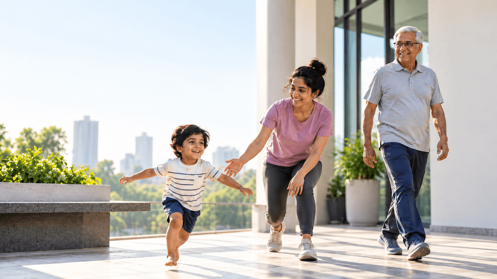 A child, a young woman and an older man moving freely on a bright clinic terrace